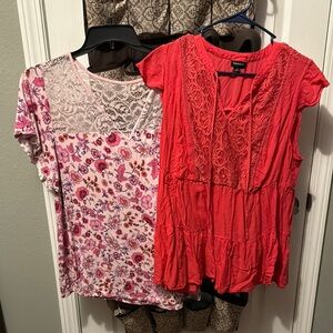 2 torrid tops, red with lace inserts and pink floral.